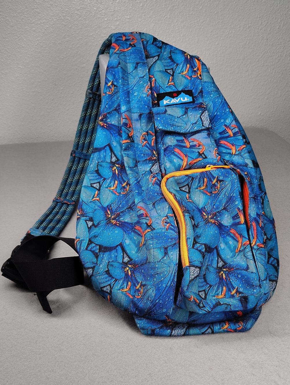 KAVU Rope Sling bag features the "Electric Lily"